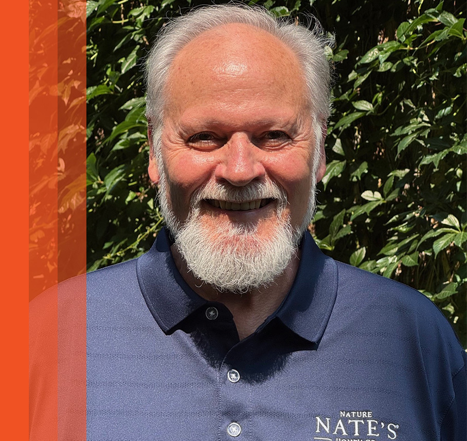 Paul headshot with orange bars.