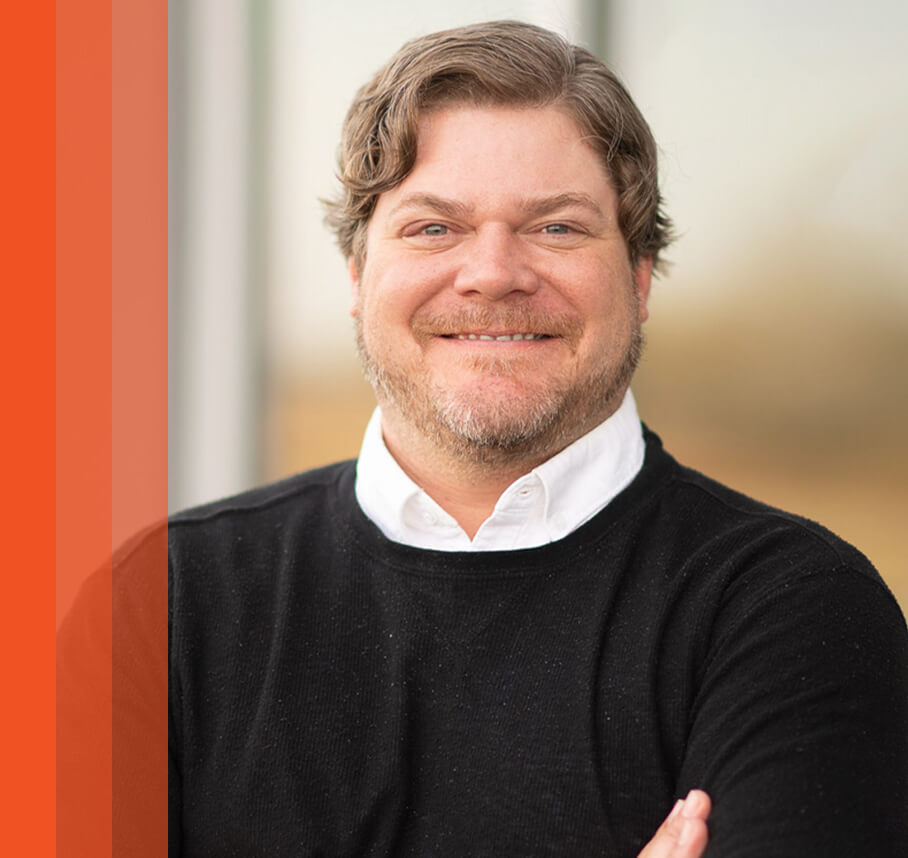 Jeff headshot with orange bars.