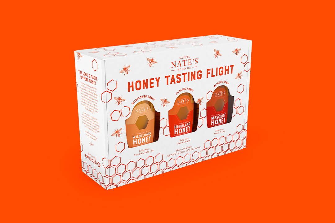 Nate's Honey Tasting Flight box with three different honey varieties against an orange background.
