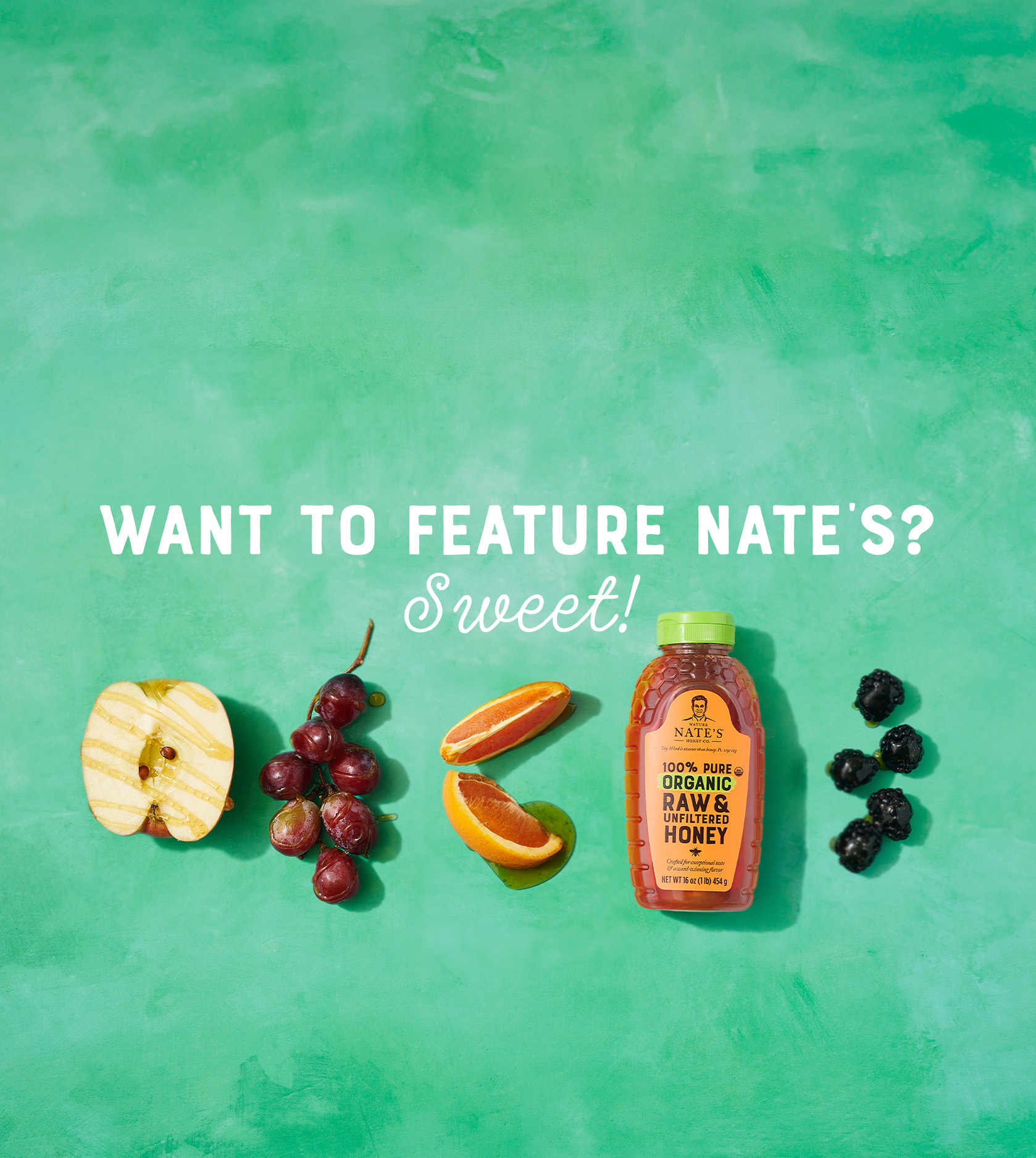Nate's honey bottle with honey-drizzled fruits, with want to feature nates sweet text, on green backdrop.